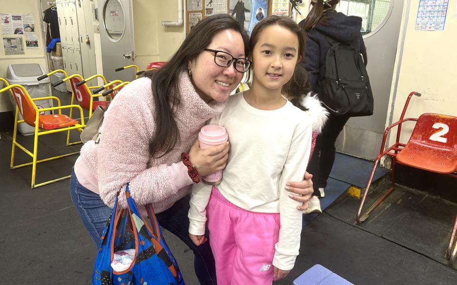 Suyin and her mother at the skating rink’s reception room.